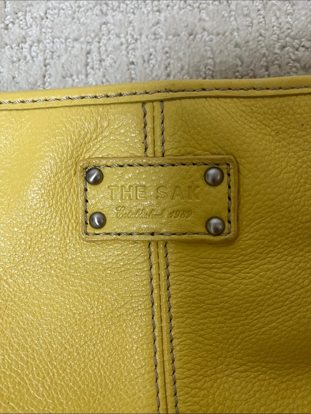 The Sak Yellow Pebbled Leather Shoulder Bag with Silver colored Hardware